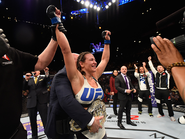 LAS VEGAS, NV - MARCH 05:  Miesha Tate reacts to her victory over Holly Holm in their UFC women's bantamweight championship bout during the UFC 196 event inside MGM Grand Garden Arena on March 5, 2016 in Las Vegas, Nevada.  (Photo by Josh Hedges/Zuffa LLC/Zuffa LLC via Getty Images)