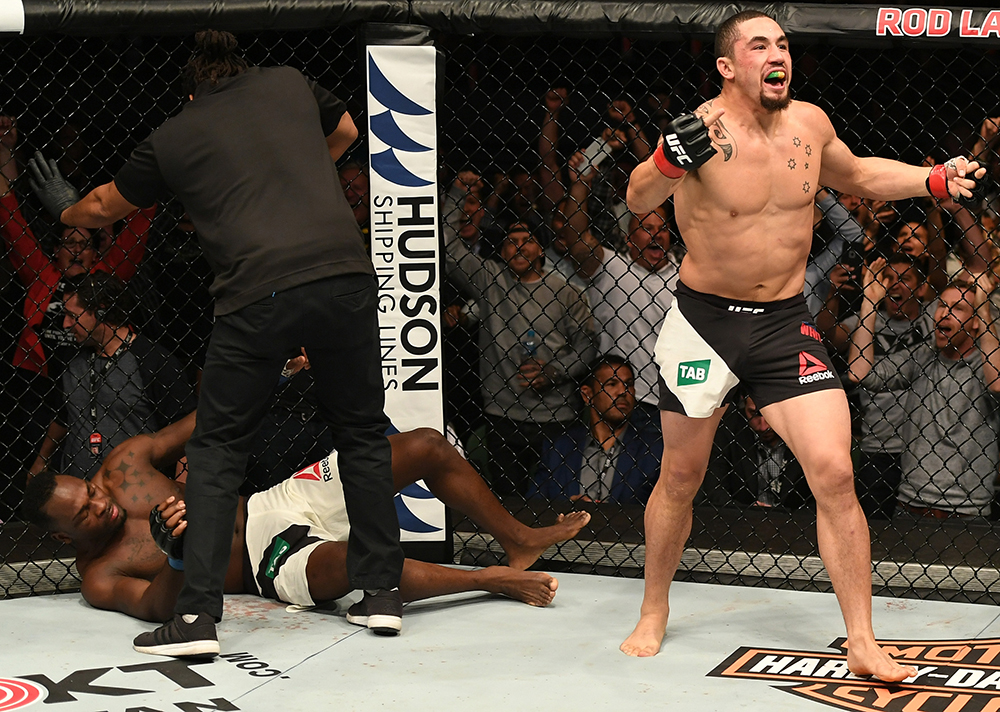 MELBOURNE, AUSTRALIA - NOVEMBER 27:   Robert Whittaker of New Zealand celebrates his TKO victory over Derek Brunson in their middleweight bout during the UFC Fight Night event at Rod Laver Arena on November 27, 2016 in Melbourne, Australia. (Photo by Jeff Bottari/Zuffa LLC/Zuffa LLC via Getty Images)